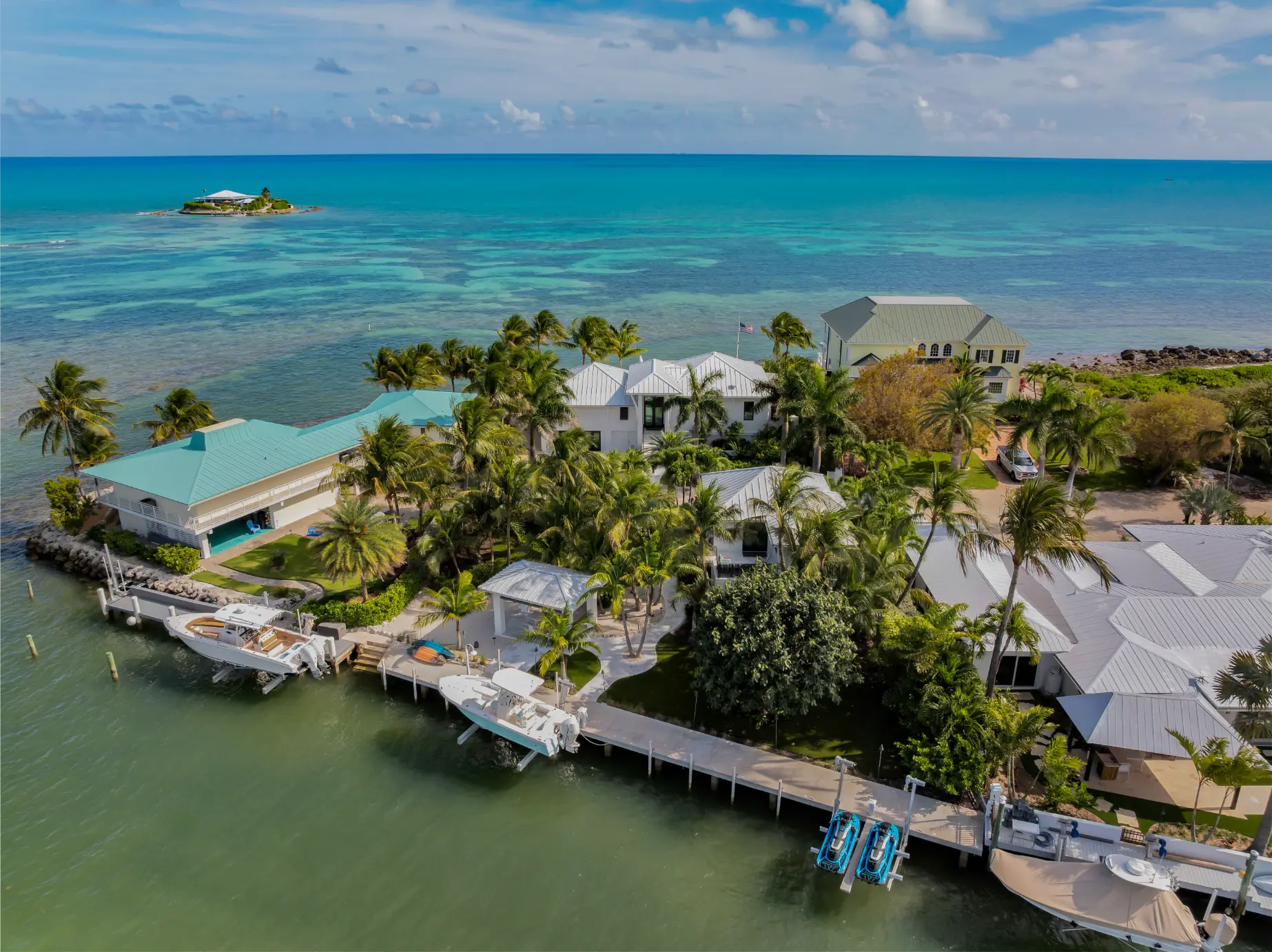 Aerial view of guest house with 107-foot boat slip and direct open ocean access