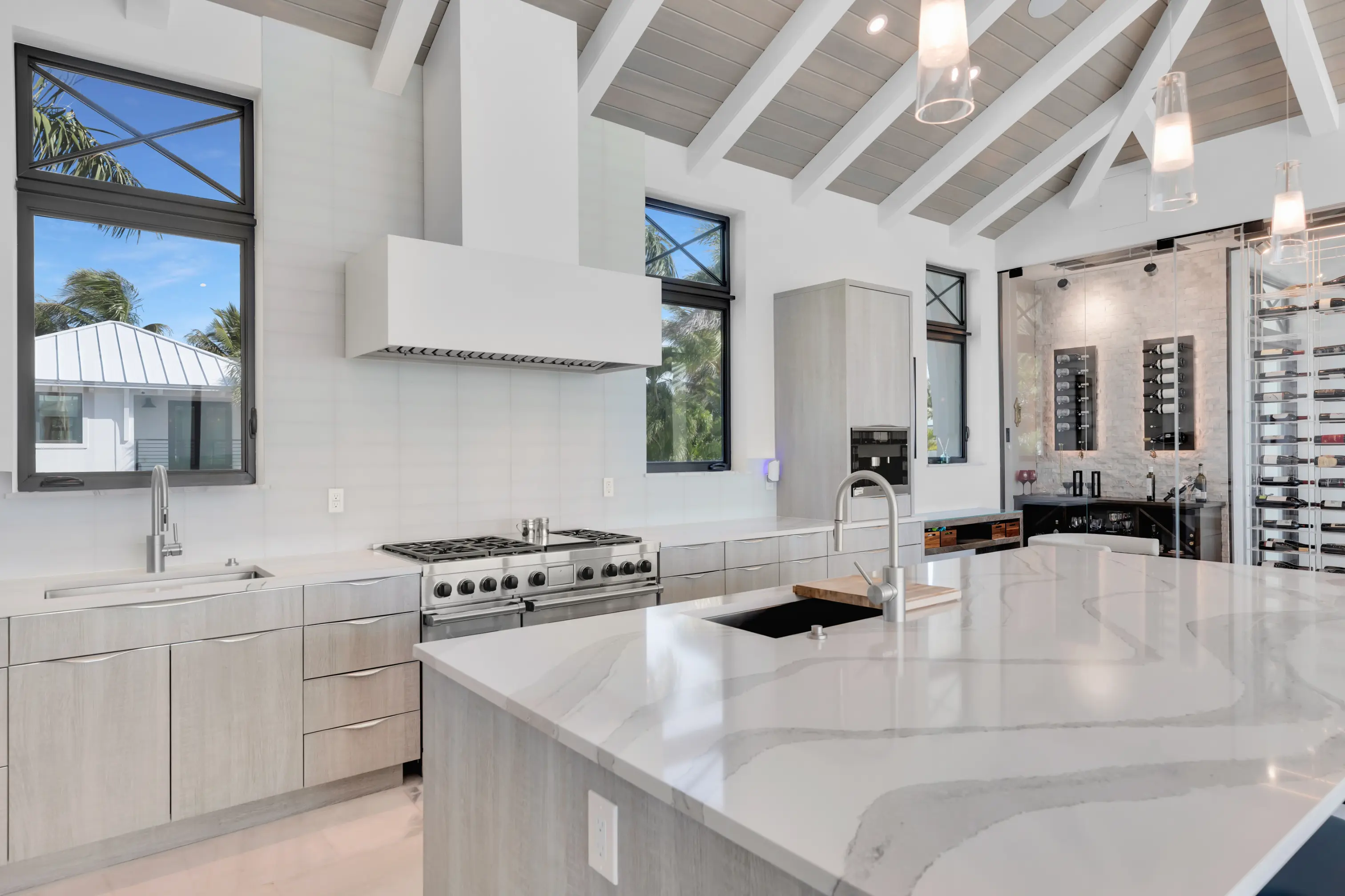 Chef's kitchen with marble island and temperature controlled wine wall